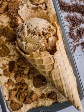 Rooibos and gingersnap ice cream in a loaf pan with a scoop of ice cream in a cone