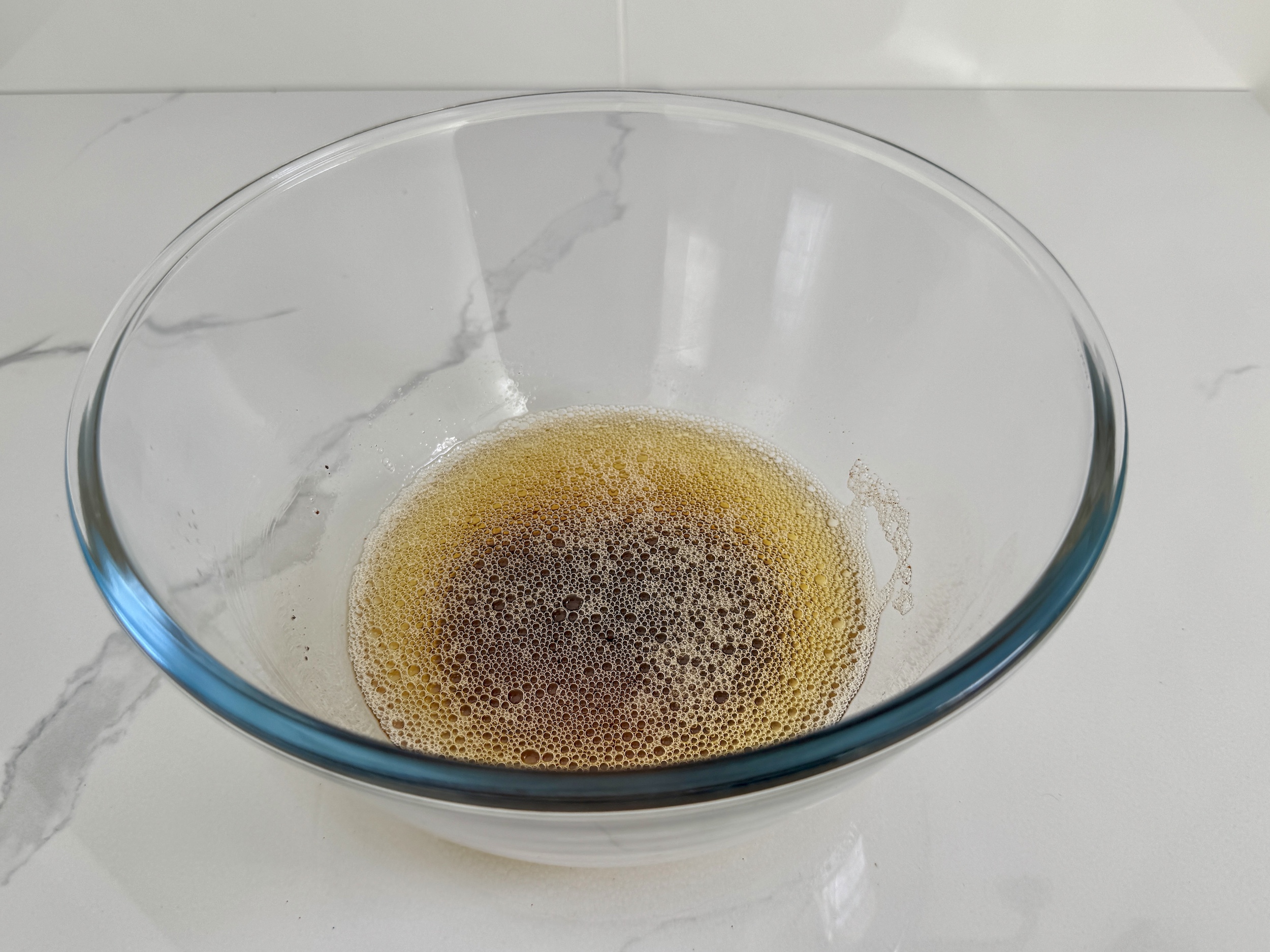 Brown butter in a glass bowl