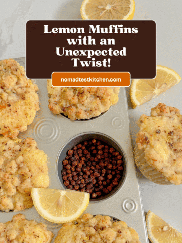 Lemon muffins in a muffin pan with lemon and peppercorns