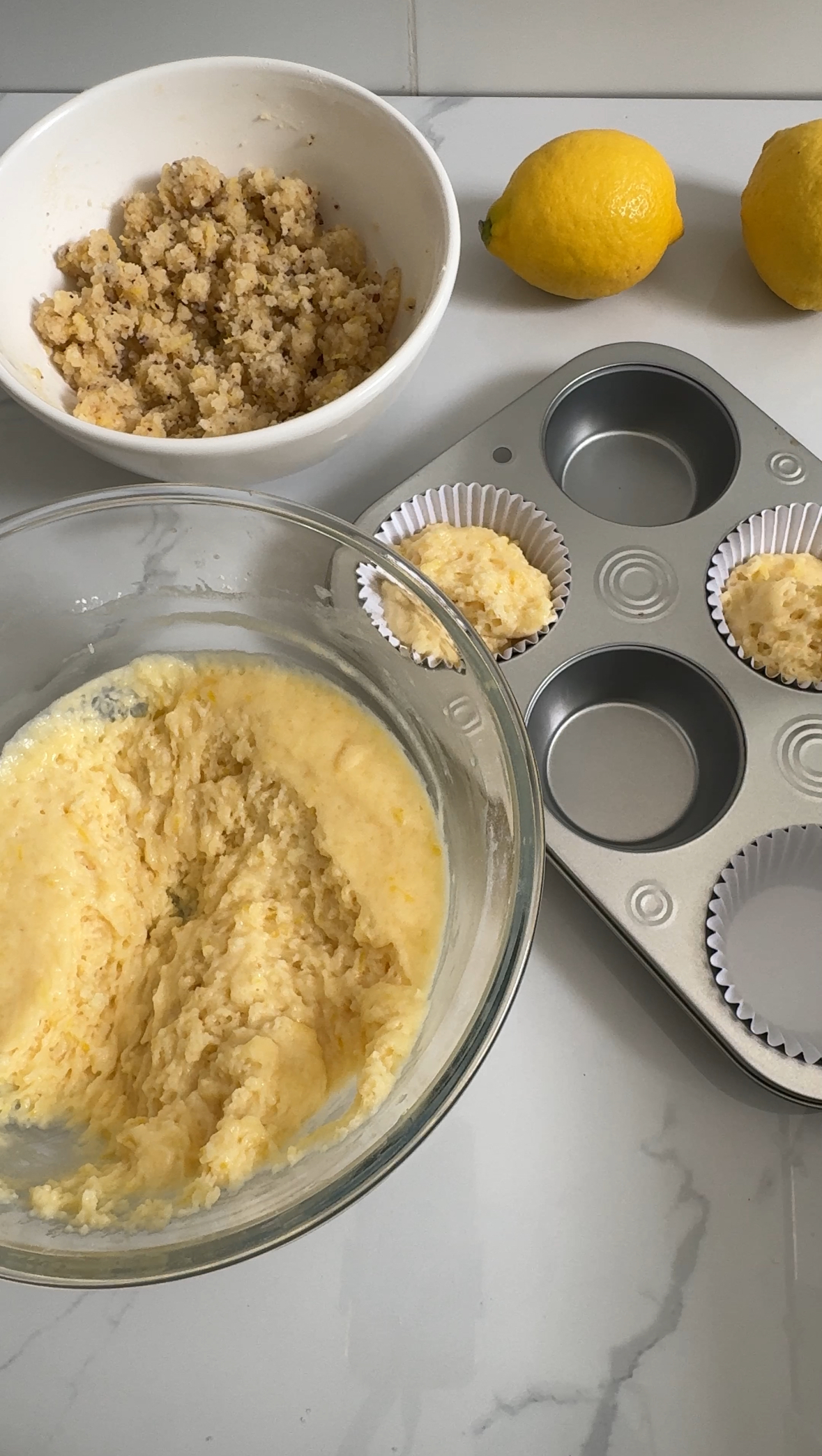 Lemon muffin batter put into muffin pan