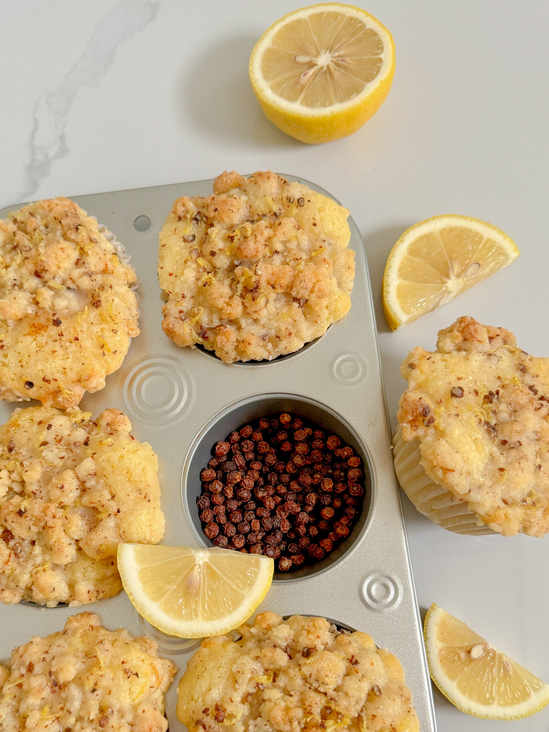 Glazed lemon muffins with streusel in muffin pan